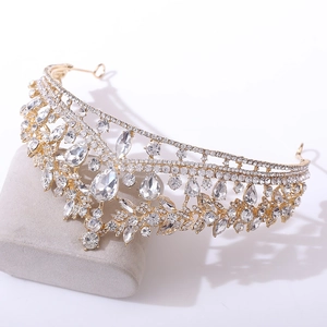 Elegant gold bridal tiara with teardrop crystals and baroque rhinestones on a display