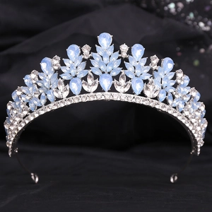 Detail of silver alloy bridal tiara with light blue rhinestones and leaf pattern design