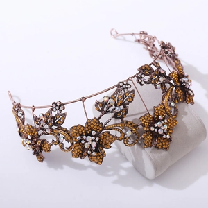Detail view of a vintage bronze bridal crown with amber floral rhinestones
