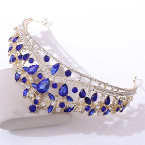 Macro detail of luxury bridal crown with blue teardrop rhinestones and gold alloy frame
