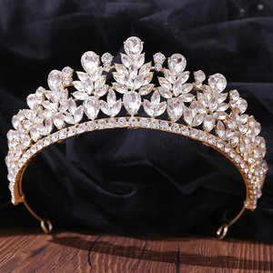 Close-up of golden bridal crown with sparkling marquise and teardrop rhinestones