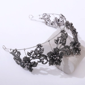 Macro detail of gothic style dark floral bridal tiara with grey rhinestones and crystals