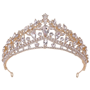 Close-up detail of luxury gold bridal crown featuring teardrop crystals and pavé rhinestones
