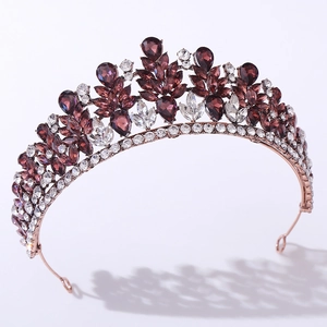Detailed macro view of pear-cut purple crystals on bridal tiara with rose gold plating