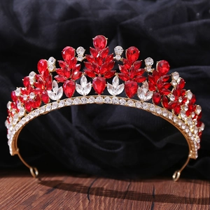 Macro detail of alloy bridal crown featuring teardrop red crystals and white rhinestones