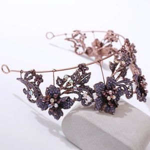 Detailed view of Baroque crown featuring vintage purple floral rhinestones and bronze frame