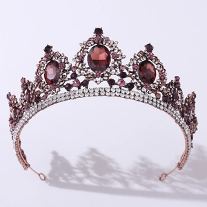 Detailed view of Baroque bridal crown with bronze filigree, red gems and crystal accents