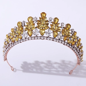 Detailed close-up of rose gold bridal tiara with yellow crystals and marquise rhinestones