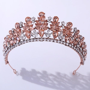 Elegant rose gold bridal crown featuring champagne pear-cut crystals and leafy diamond accents