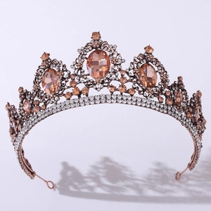 Detailed macro view of bronze baroque bridal crown with amber stones and rhinestones