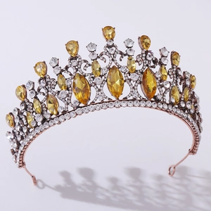 Close-up of vintage baroque tiara with amber crystals and white rhinestones detail