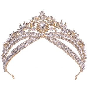 Close-up of luxury bridal crown with intricate gold plating and shimmering rhinestones