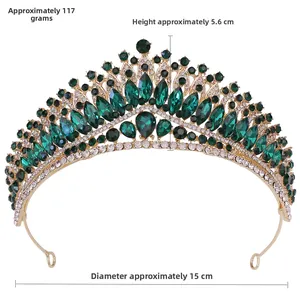 Detail view of gold bridal crown with green gems, weight 117g, height 5.6cm, diameter 15cm
