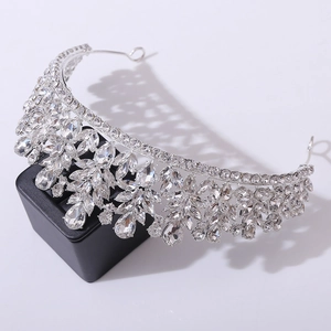 Detailed macro shot of bridal tiara with sparkling crystal leaves on black display base