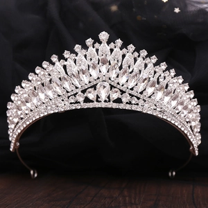 Detailed macro view of luxury silver bridal crown with shimmering crystals and teardrop stones