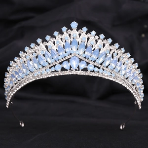 Close-up of luxury bridal crown with light blue crystals and silver metal base