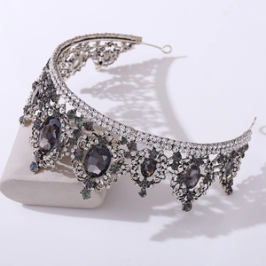 Detailed side view of Baroque silver crown with grey rhinestones and sparkling crystals