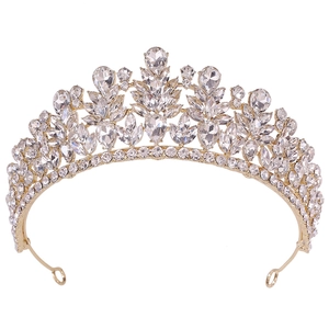 Detailed close-up of golden alloy bridal crown with pear and marquise-cut rhinestones