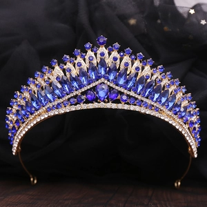 Macro detail of luxury baroque tiara with navy blue crystals and golden alloy frame