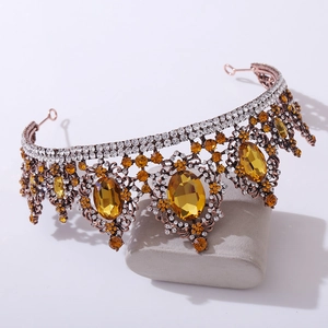 Macro detail of Baroque bridal tiara with amber crystals and fine rhinestone inlay