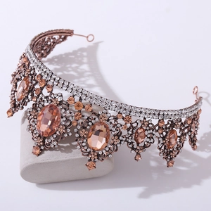 Detail view of Baroque crown with champagne crystals on a rose gold metal base