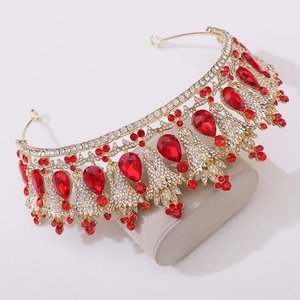 Macro detail of bridal crown featuring red pear-shaped gemstones and white crystals