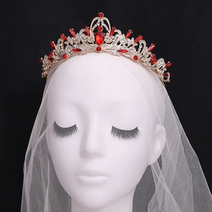 Golden bridal crown with red teardrop rhinestones and sparkling white crystal details