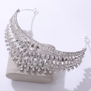 Detailed side view of luxurious silver bridal crown with shimmering pear-cut crystals