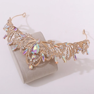 Macro detail of golden bridal tiara with colorful AB crystals and leaf pattern