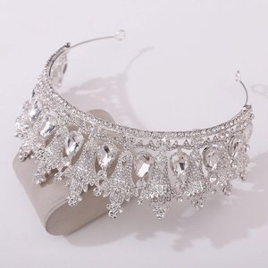 Close-up of silver bridal crown with intricate alloy base and teardrop crystals