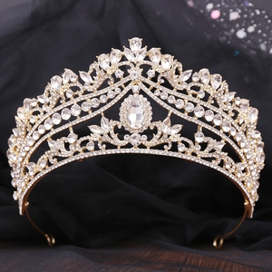 Detailed close-up of a bridal crown with rhinestones on a black silk background
