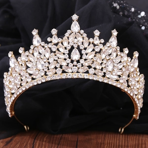 Macro detail of Baroque bridal crown featuring teardrop crystals and ornate metalwork