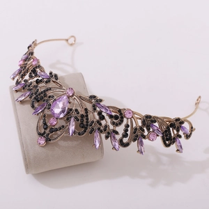 Elegant vintage gold bridal crown with purple pear-shaped crystals and black rhinestones