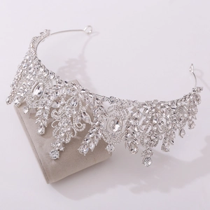 Detailed macro view of silver baroque bridal crown with crystal wheat leaf and teardrop gems