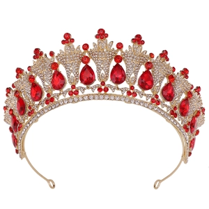 Detailed macro view of the golden alloy bridal crown with red drop-shaped gemstones