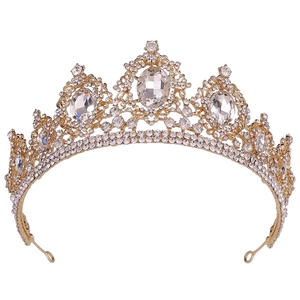 Detailed view of the baroque gold alloy tiara with intricate crystal and rhinestone settings