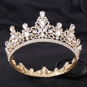 Detailed macro view of luxury baroque bridal crown with red crystals and gold alloys