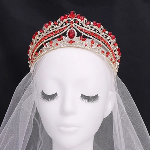 Elegant bridal crown with red rhinestones and white veil for wedding ceremonies