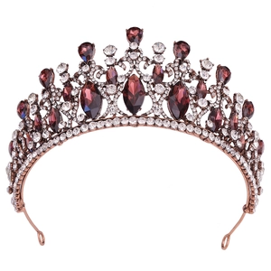 Detailed view of the baroque crown featuring purple teardrop crystals and filigree metal