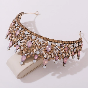 Macro shot of Baroque crown featuring pink teardrop stones and champagne crystals