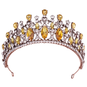 Detail of baroque crystal crown with amber marquise stones and sparkling white rhinestones