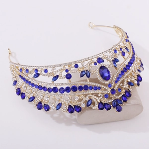 Detailed macro view of royal blue gemstones and crystals on golden bridal crown