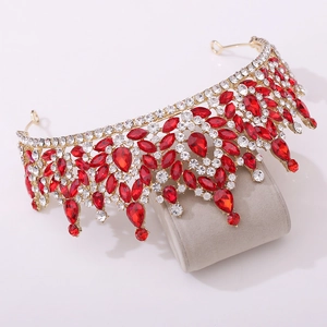 Close-up of Baroque gold crown featuring ruby red waterdrop crystals and clear rhinestones