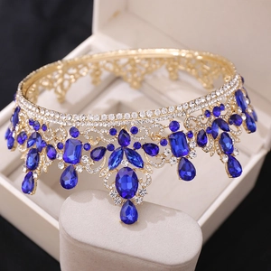 Luxurious gold baroque crown with deep blue crystals and diamonds for brides