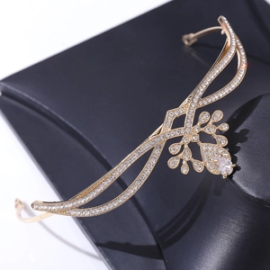 Elegant gold bridal tiara with zircon stones and water drop centerpiece in wavy design