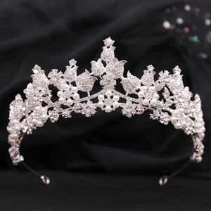 Elegant bridal floral tiara featuring sparkling crystals and white pearls in silver finish