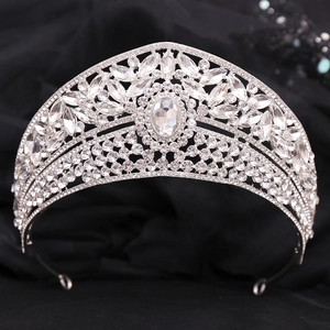Close-up of silver bridal tiara with sparkling crystal rhinestones and oval center stone