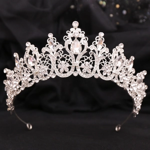 Detailed macro shot of bridal crystal tiara featuring silver metal and intricate rhinestones