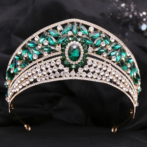 Detail of luxury bridal tiara featuring emerald green crystals and sparkling rhinestones
