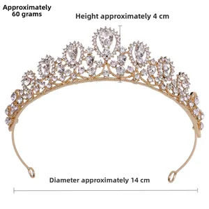 Close-up of gold princess tiara with white rhinestones weighing 60g and 4cm height